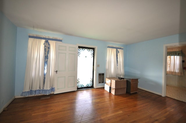 entrance foyer with dark hardwood / wood-style floors