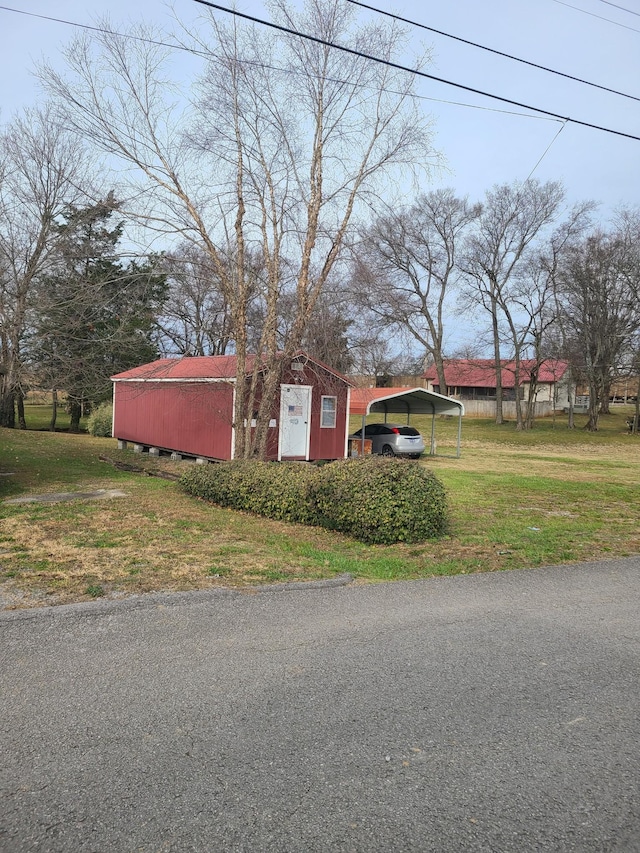 exterior space with a front yard and a carport