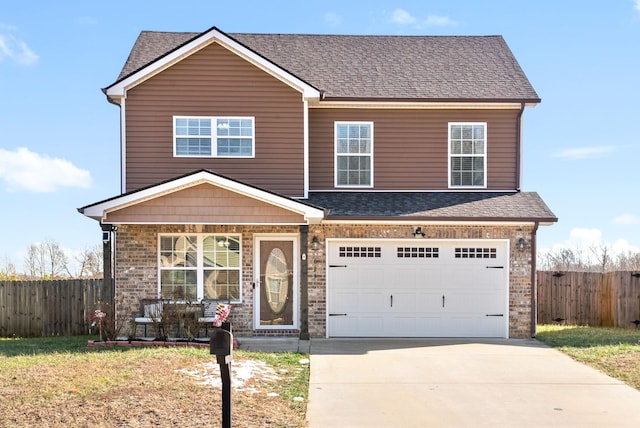 view of front of property with a porch, a front yard, and a garage