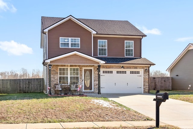 view of front facade with a porch, a front lawn, and a garage