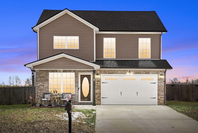 view of front of property with a garage