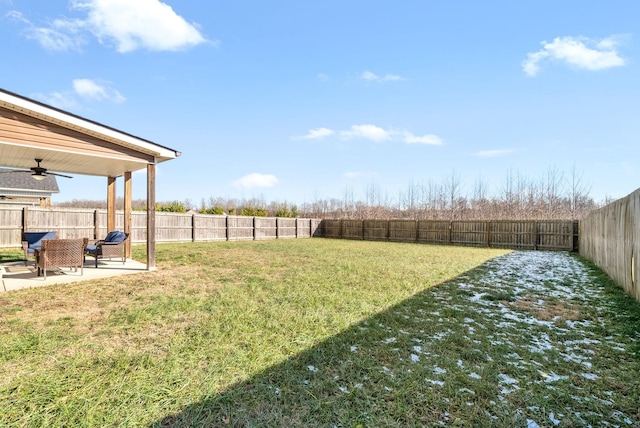 view of yard featuring a patio and ceiling fan