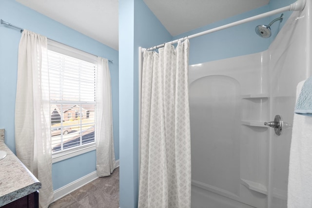 bathroom featuring vanity and a shower with curtain