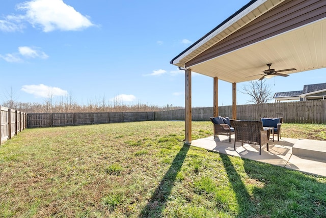 view of yard with ceiling fan and a patio