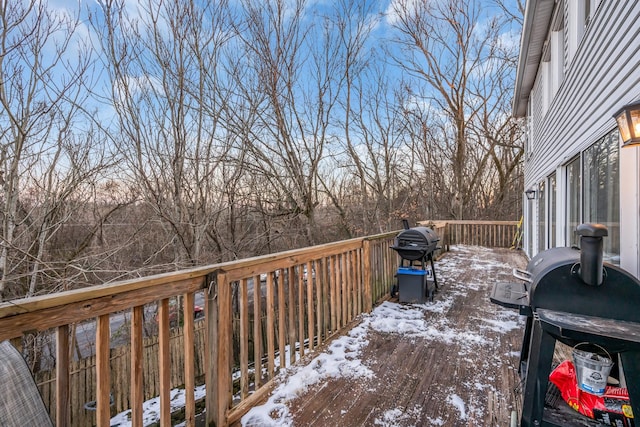 snow covered deck with area for grilling