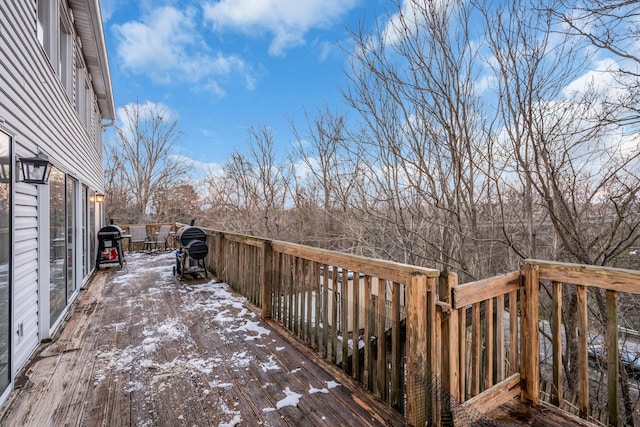 snow covered deck featuring grilling area