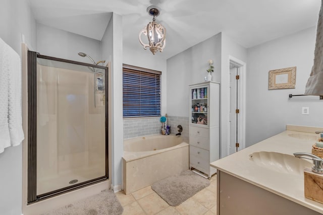 bathroom with tile patterned floors, plus walk in shower, vanity, and a notable chandelier