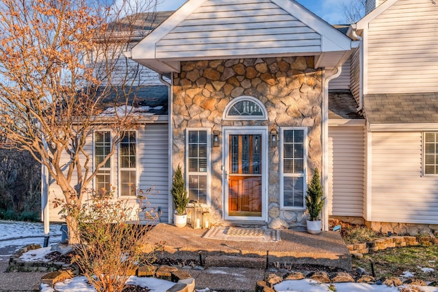 view of snow covered property entrance