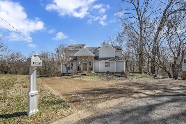 view of front of property featuring a chimney