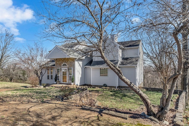 view of front of home with a chimney