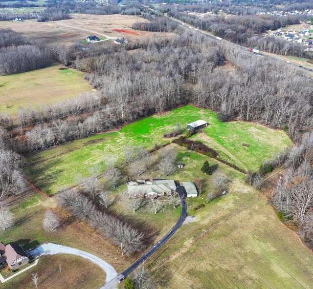 birds eye view of property with a rural view