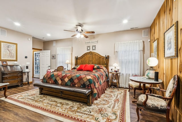 bedroom with ceiling fan and dark hardwood / wood-style flooring