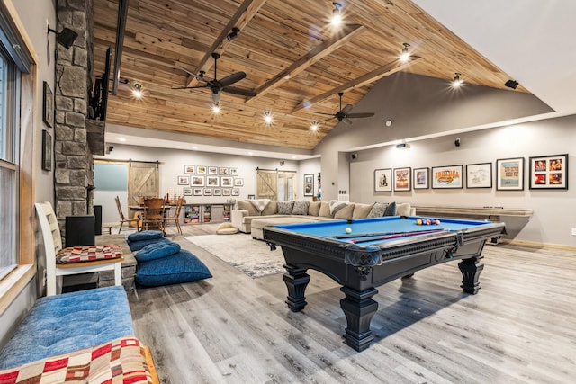 recreation room featuring high vaulted ceiling, wood-type flooring, ceiling fan, a barn door, and wooden ceiling