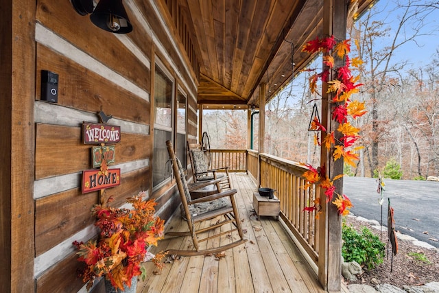 wooden terrace featuring a porch