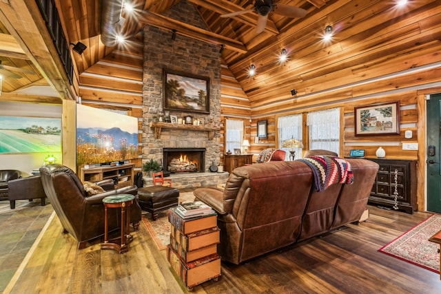 living room with a fireplace, high vaulted ceiling, wood-type flooring, ceiling fan, and beam ceiling