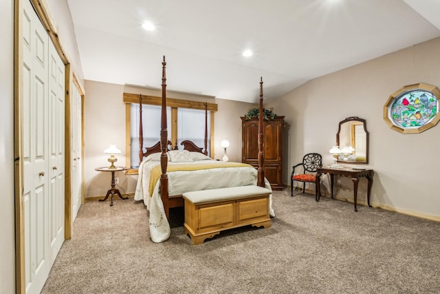 bedroom featuring vaulted ceiling, light carpet, and a closet