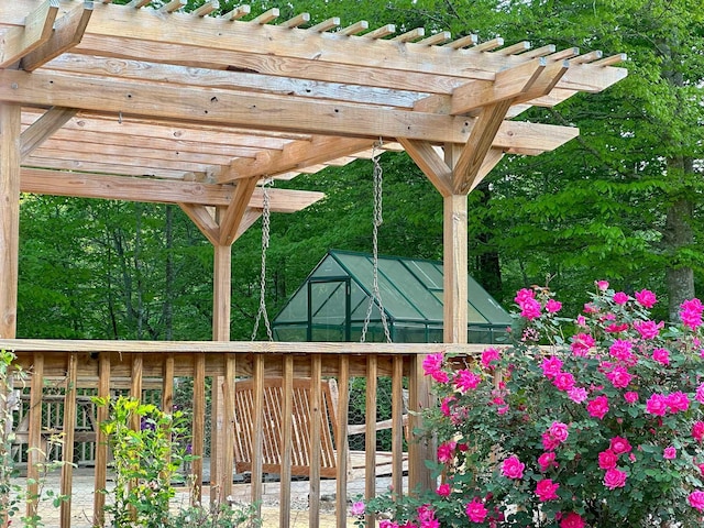 exterior space featuring a pergola and a deck