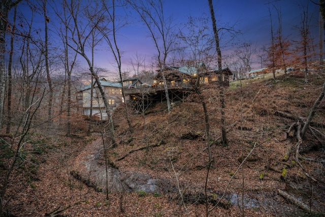 view of back house at dusk