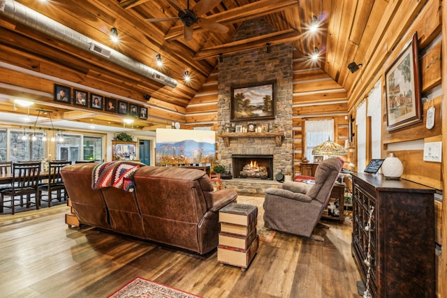 living room with plenty of natural light, a fireplace, hardwood / wood-style floors, and wooden ceiling