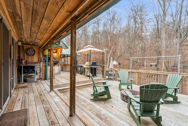 deck with a gazebo and area for grilling