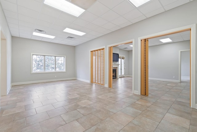 empty room featuring a paneled ceiling