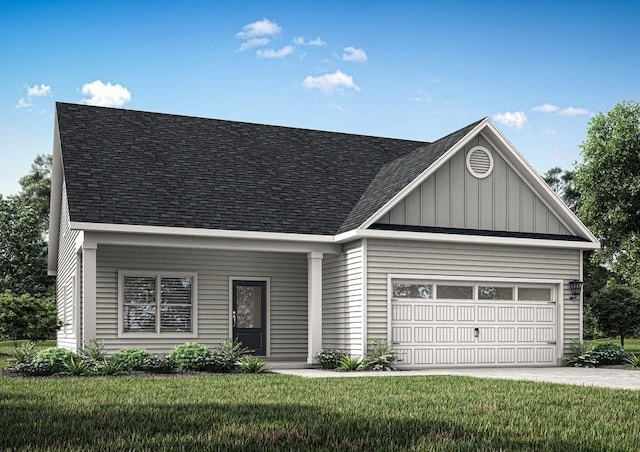 view of front of house with a front lawn and a garage