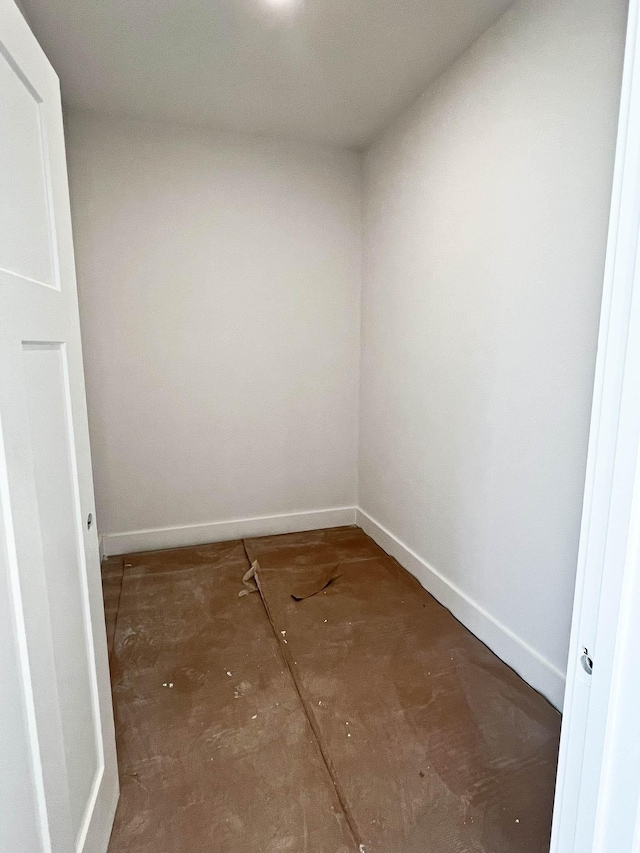 interior space featuring baseboards