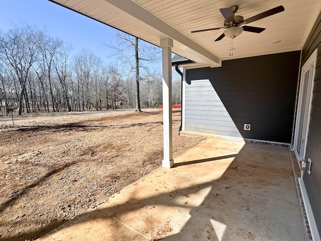 view of yard with a ceiling fan and a patio