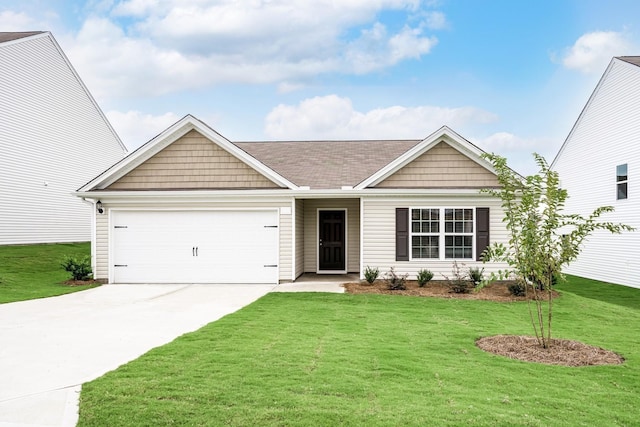 view of front of house featuring a garage and a front yard