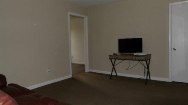 146 Garden Dr, Lafayette, TN 37083 - unfurnished living room with carpet flooring and baseboards