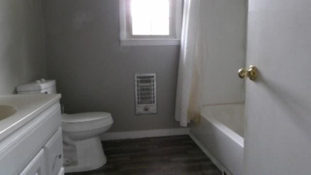 146 Garden Dr, Lafayette, TN 37083 - bathroom featuring vanity, a tub, heating unit, wood finished floors, and a shower with shower curtain