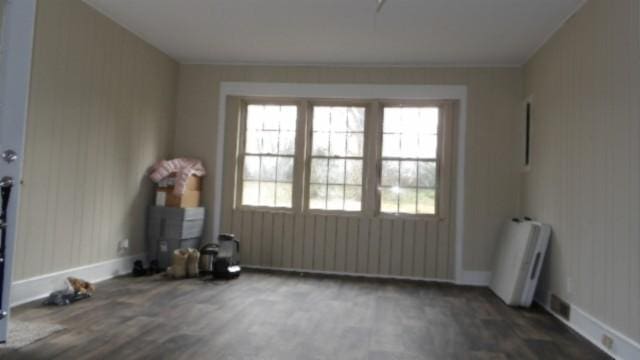 146 Garden Dr, Lafayette, TN 37083 - empty room with wood finished floors and radiator