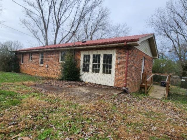 146 Garden Dr, Lafayette, TN 37083 - view of side of home with brick siding