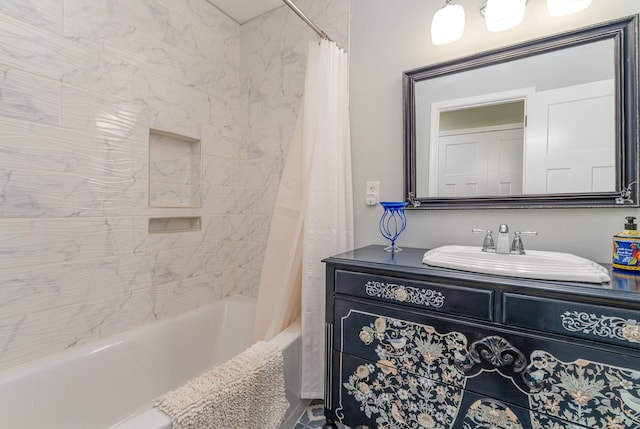 bathroom featuring vanity and shower / bath combo with shower curtain