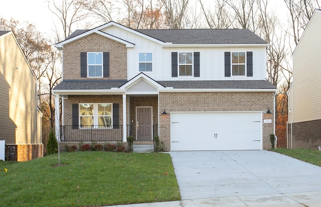 view of front of house with a garage and a front yard