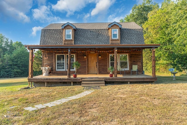 cabin with a front lawn and a porch