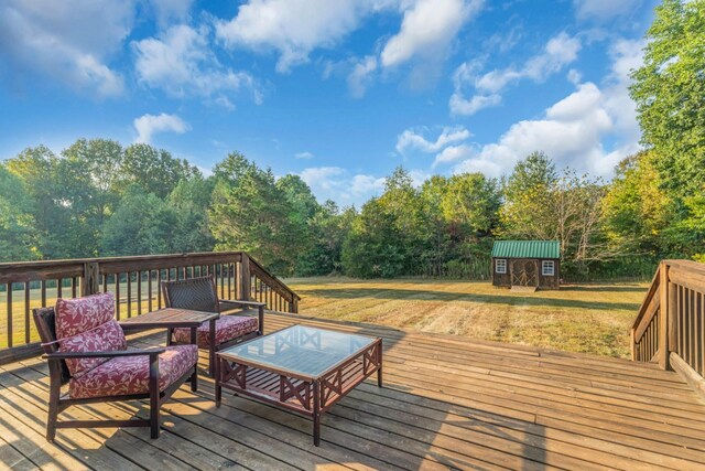 wooden terrace featuring a yard and a storage shed