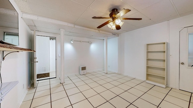 unfurnished room with a drop ceiling, ceiling fan, and light tile patterned flooring