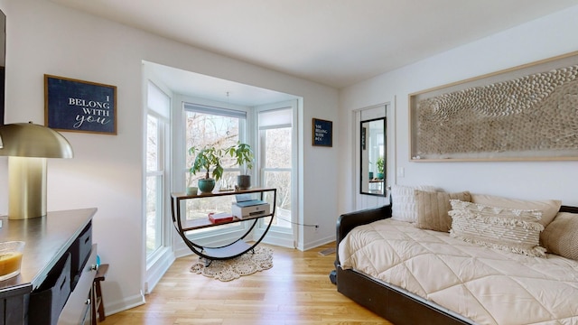 bedroom with light wood-type flooring