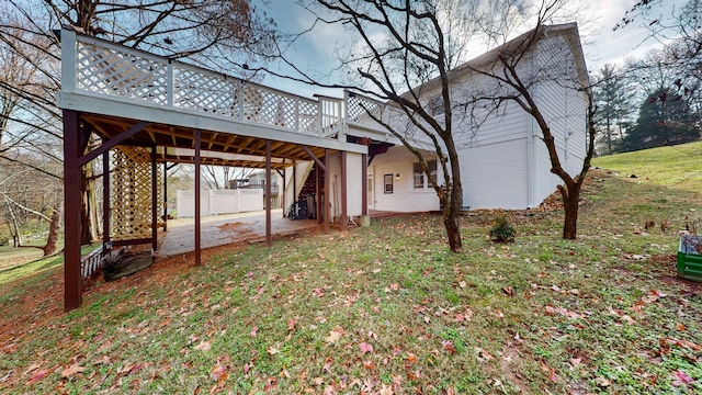 view of yard featuring a deck and a patio area