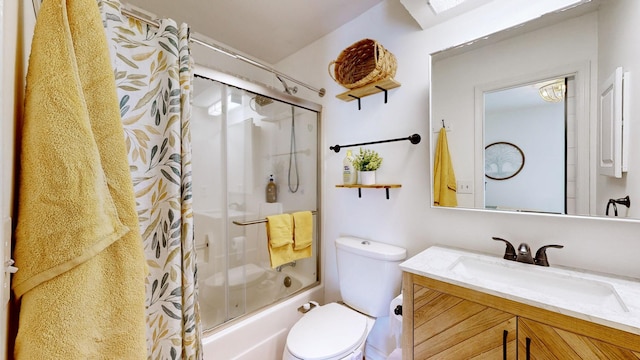 full bathroom with vanity, toilet, and bath / shower combo with glass door