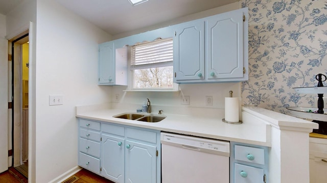 kitchen featuring white cabinetry, sink, white dishwasher, and dark wood-type flooring