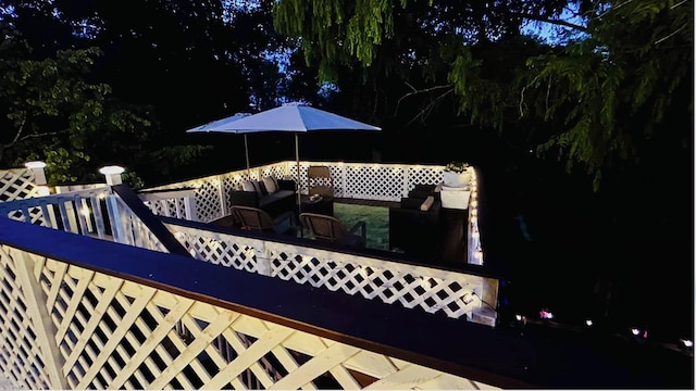 deck at night with outdoor lounge area