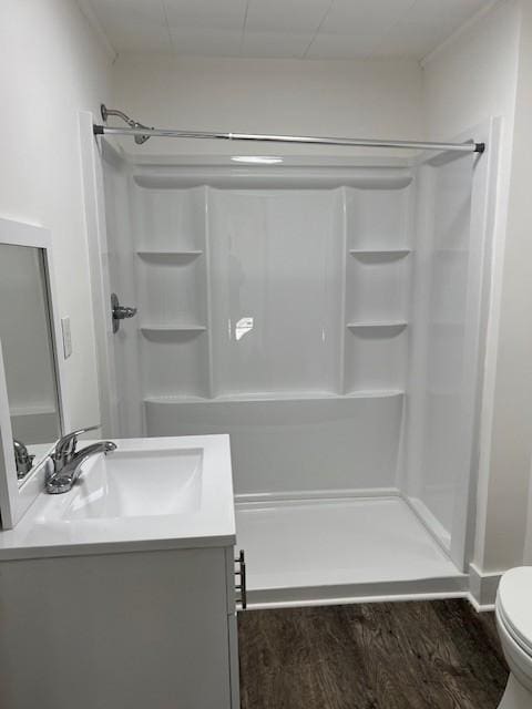 bathroom with vanity, toilet, and walk in shower