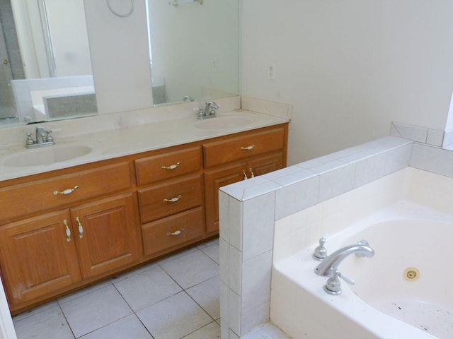 bathroom featuring vanity, tile patterned floors, and a bathtub