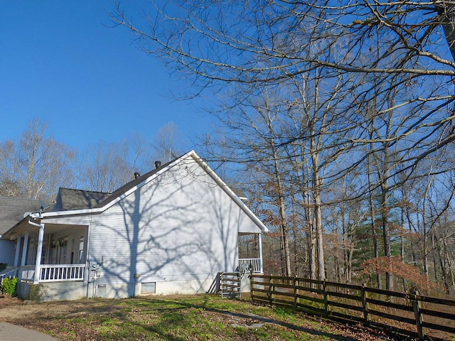 view of property exterior featuring a porch