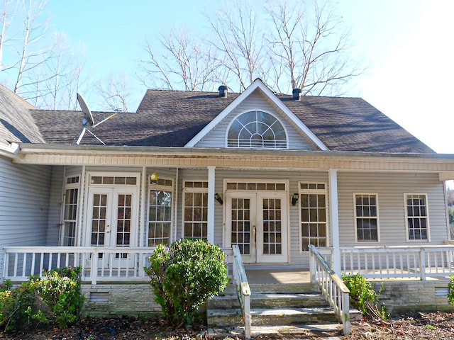 back of house with covered porch and french doors