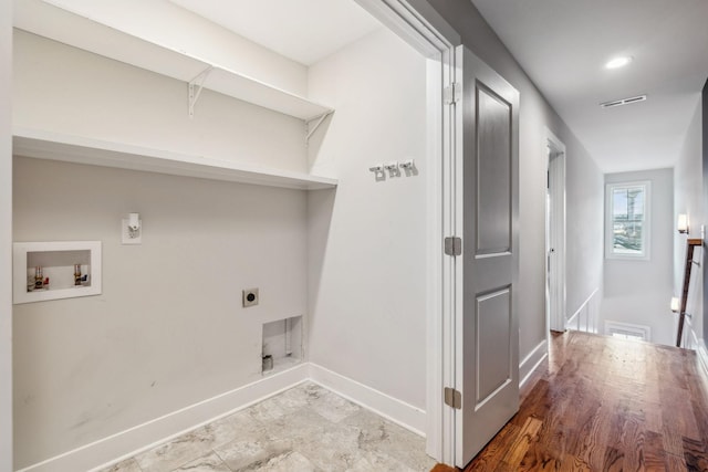 laundry room featuring visible vents, laundry area, hookup for a washing machine, and electric dryer hookup