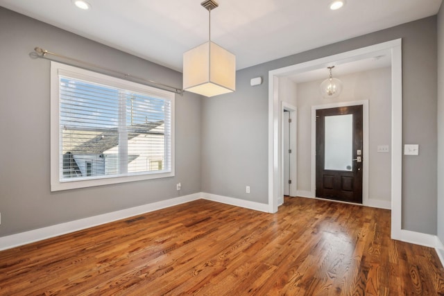 entryway featuring recessed lighting, wood finished floors, visible vents, and baseboards