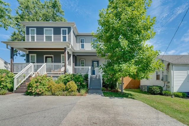 view of front of home featuring central AC unit and covered porch